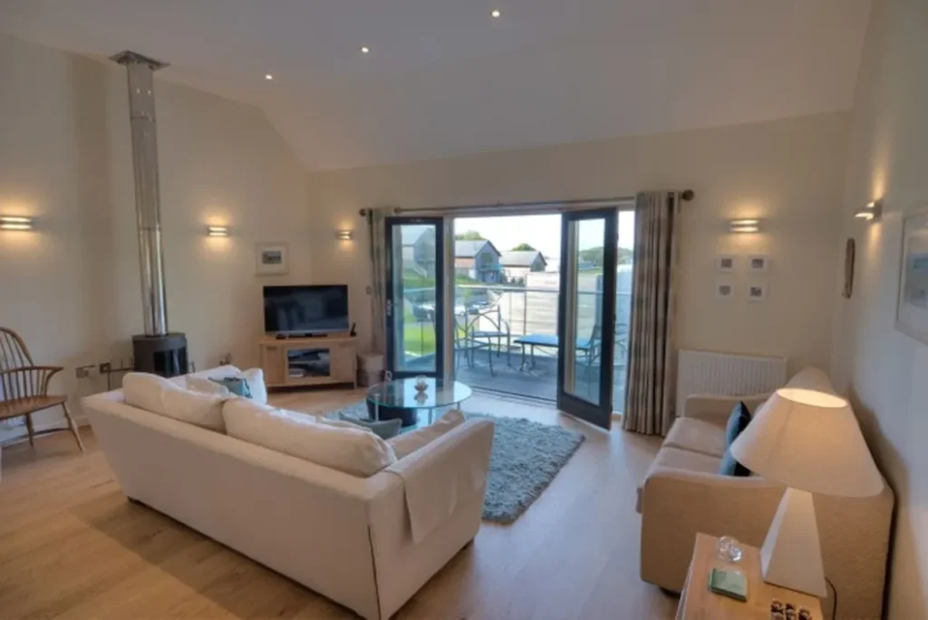 Fitted kitchen and dining space inside an eco lodge for sale